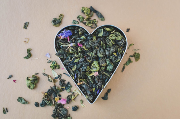 heap-green-tea-leaves-heart-shaped-mix-herbal-tea_156843-165